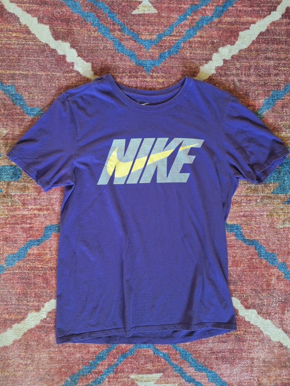 Nike Purple Graphic Tee with Yellow/Blue Logo